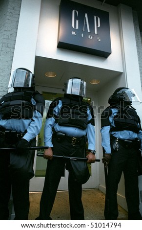 WASHINGTON, DC - SEPT 27: Police in full riot gear and batons guard Gap stores during anti-sweatshop protests in Washington, DC on Sept. 27, 2002.