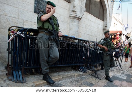 JERUSALEM - AUGUST 15: Israeli security forces armed with assault rifles patrol the streets of Jerusalem on August 15, 2010 in Jerusalem.