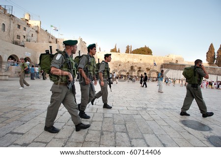 JERUSALEM - SEPTEMBER 7: Israeli security forces armed with assault rifles patrol the Western Wall in Jerusalem on September 7, 2010. Status of such holy sites is a major issue in peace negotiations.