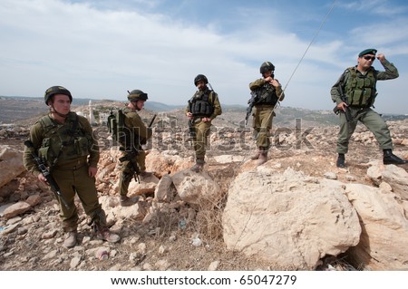 AL-WALAJA - NOVEMBER 13: Israeli soldiers stand by during a nonviolent protest against the Israeli separation barrier on Nov. 13, 2010 in Al-Walaja.