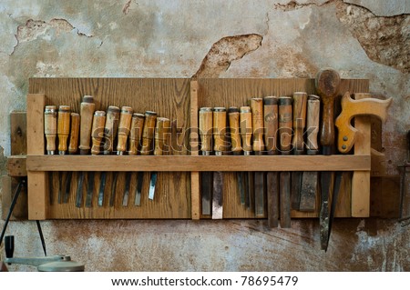 A rack of chisels and other carpentry tools hang on a carpentry shop wall in the old city of Nazareth, Israel.