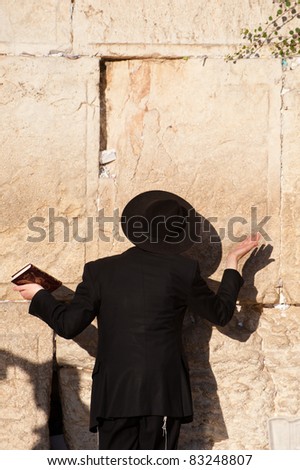 JERUSALEM - AUGUST 21: An ultra-orthodox Jewish man prays at the Western Wall, the holiest site in Judaism, in the Old City of Jerusalem on Aug. 21, 2011.