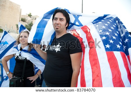 JERUSALEM - AUGUST 24: Zionists wave American and Israeli flags at a Glenn Beck rally in Jerusalem on August 24, 2011.