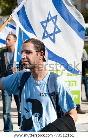 TEL AVIV - DECEMBER 9: Right-wing counter demonstrators wave Israeli flags during a Tel Aviv march celebrating the Universal Declaration of Human Rights on Dec 9, 2011.