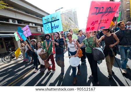 TEL AVIV - DECEMBER 9: Protesters chant to the beat of drums as thousands of activists take to the streets in the annual human rights march in Tel Aviv on Dec 9, 2011.