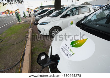 PARIS - NOVEMBER 30: A fleet of electric cars charges in front fo the COP21 UN climate conference in Le Bourget near Paris, France, November 30, 2015.