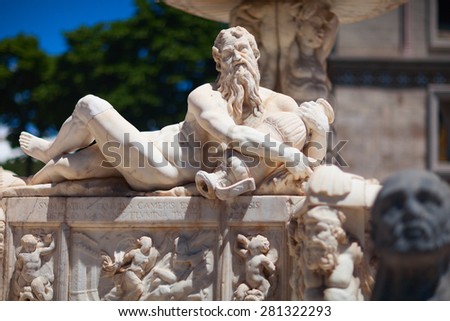 MESSINA, ITALY - 17 MAY 2012: Orion fountain. Triton marble sculpture. Part of the monumental fountain created by Michelangelo in 1553. It depicts the triumph of Orion.