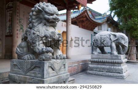 XIAMEN, CHINA - 30 SEPTEMBER 2014: Stone sculptures of the holly animals. Entrance to the South Putuo (Nanputuo) temple. Buddhist temple founded in the Tang Dynasty in the Chinese city of Xiamen