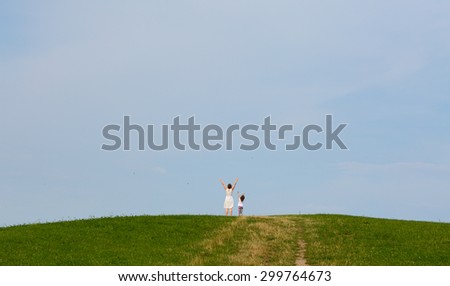 Two person on the top of the hill reached the peak