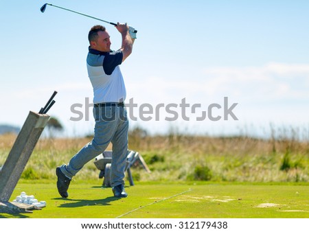 Golf player on the golf field. Cape Kidnappers golf court. New Zealand.