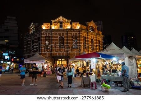 TAIPEI, TAIWAN - May 2: The Red House in Ximending of Taipei at night time with weekend art market which is the gathering place for young artists and creatives on May 2, 2015 in Taipei, Taiwan.