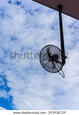 big electronic fan for outdoor using in silhouette with propelle
