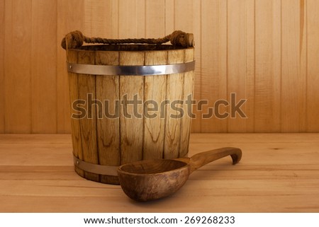 wooden bucket  with ladle  in sauna