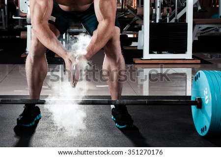 Young athlete getting ready for weight lifting training