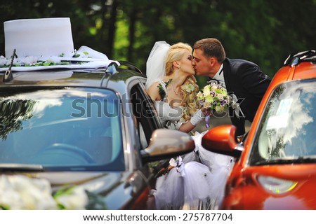 Just married at the wedding cars