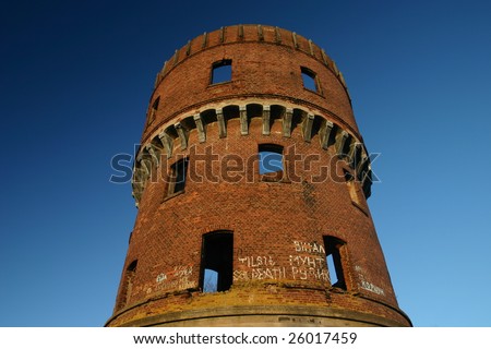 Old brick tower against the dark blue sky