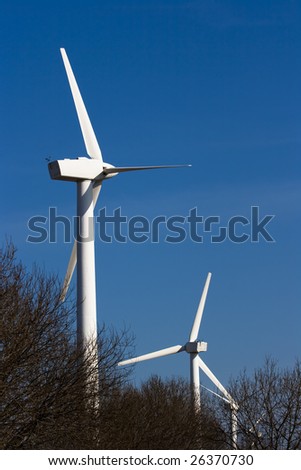 Wind power station against the sky and clouds
