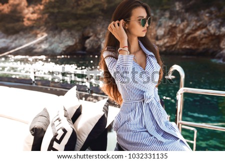 Hot summer girl beauty sexy lady wear fashion silk dress casual clothes party date romantic model woman luxury life style accessory catalog collection pretty face  posing on yacht