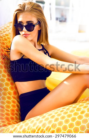 Beautiful young sexy blonde girl in swimsuits and makeup, summer trip on a yacht with white sails on the sea or ocean in the Gulf marine of the wind and the breeze in the sun tans romantic,lounge zone
