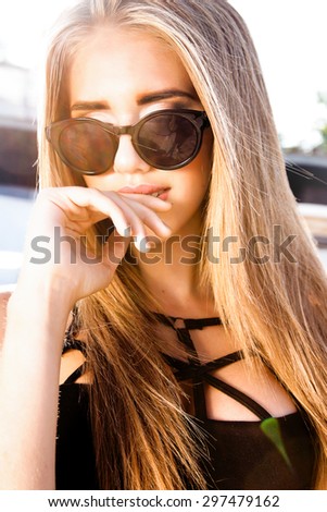 Beauty Sunshine Girl Portrait.Pretty happy woman enjoying summer outdoors.Sunny Summer Day under the Hot Sun on the Beach.sunglasses isolate.fall fashion,amazing portrait,hairstyle,swimsuits,accessory