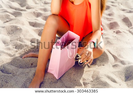 Close-up fashion details of woman celebrate her birthday on summer,relax after shopping holidays,shopping bag,summer accessories,gift certificate,rest after shopping,shopaholic,gift bag discount