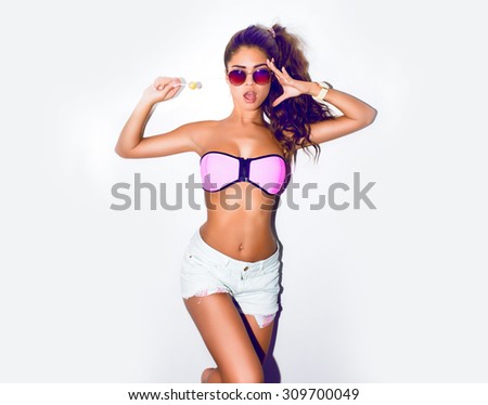 Young sexy happy woman looking at camera. Portrait of trendy girl having fun. Toned, White background,not isolated.Outdoors lifestyle portrait,emotional girl,trendy chic,lovely girl,impressed woman