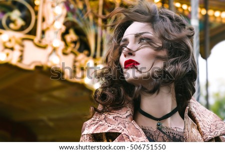 Outdoor  portrait of woman posing over christmas holiday background,amazing woman with curly hair,red lips,Fashion Lady with Beautiful Luxury Hairstyle,makeup,accessories,black Choker,xmas fair,Paris