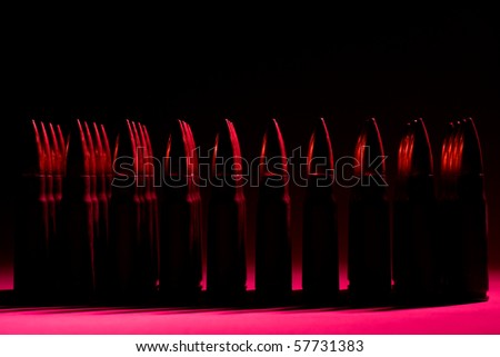 Bullets on a black and red background.