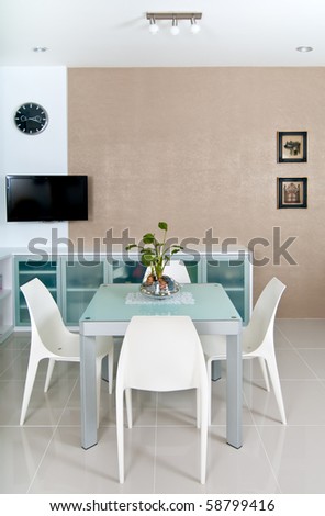 Small and contemporary dining room with TV
