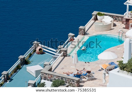 stock photo : Sun bathing and relaxing at luxury resort in Santorini island of