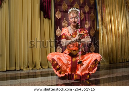 Caucasian woman in traditional indian dress is meditation.