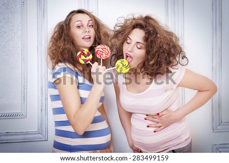 pregnant girls with crazy hairstyles and sweets in his hands