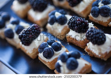 Plate of small waffles with cream cheese