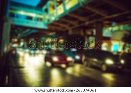 people in bokeh, street of night Bangkok, highway