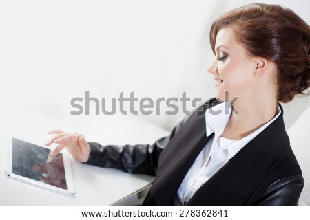 Successful business woman, laughs looking at the laptop screen