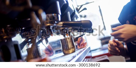 young girl Barista prepares coffee in pub, bar, restaurant