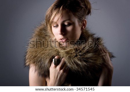 young beautiful girl in a fur collar