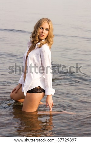 stock photo young beautiful girl in a wet shirt