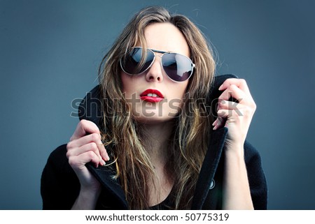 Rock\'n\'roll girl. Portrait of the girl in sun glasses