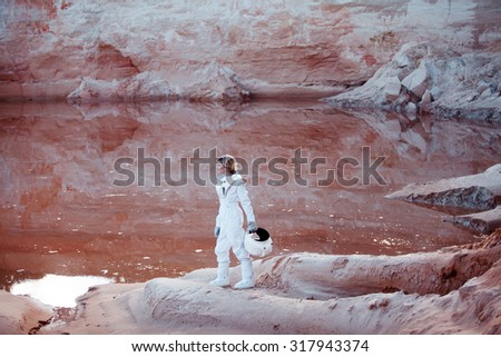 futuristic astronaut on another planet, image with the effect of toning