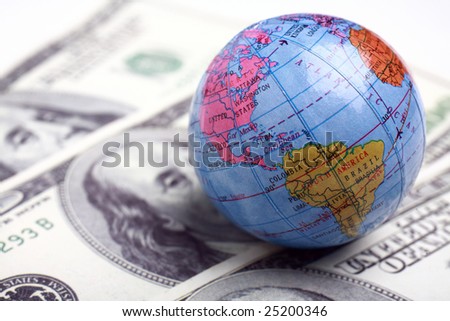 a globe and cash close up