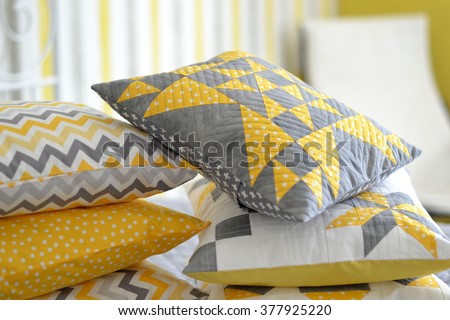 Patchwork/quilt pillows in gray, yellow and white