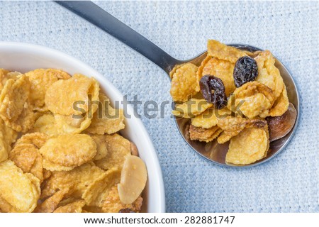 Mix cereal, corn flakes on a spoon