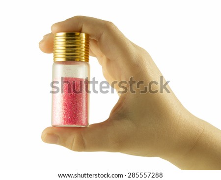 Nail glitters on hand isolated with clipping path on white background