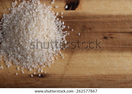 Pile of rice on the wooden board