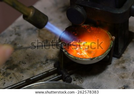 Melting silver in a jewelry workshop