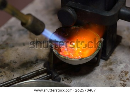 Melting silver in a jewelry workshop