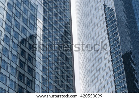 Skyscrapers with glass facade. Modern buildings in Paris business district. Concepts of economics, financial, future.  Copy space for text. Dynamic composition