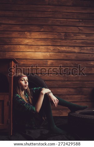 teenager in a dark studio