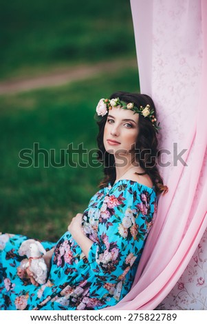 Pregnant gentle girl on the nature